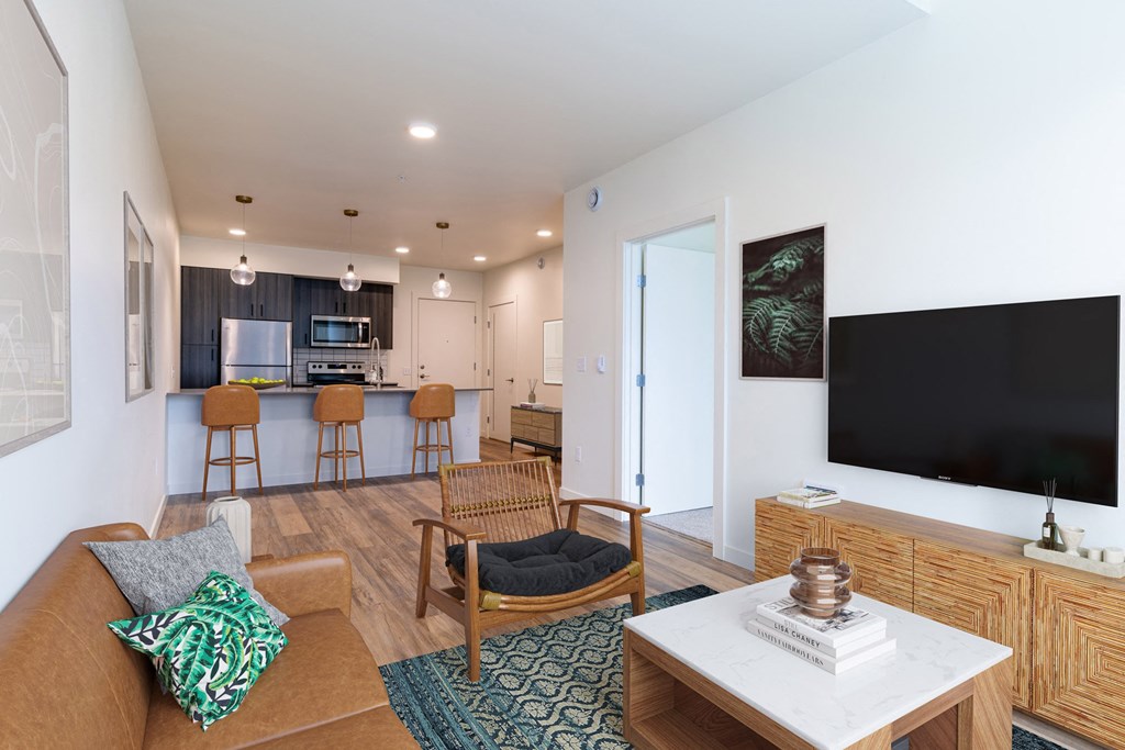 a living room with a couch and a table with a television at Rivulet, Washington, 98383