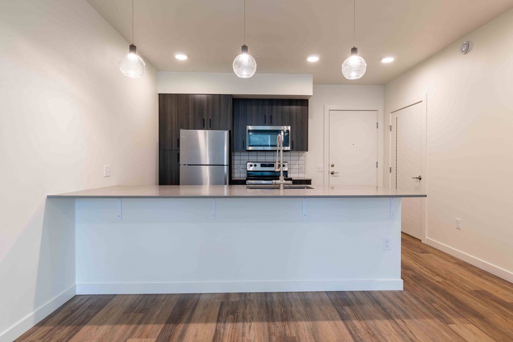 a kitchen with a counter top and a refrigerator at Rivulet, Washington