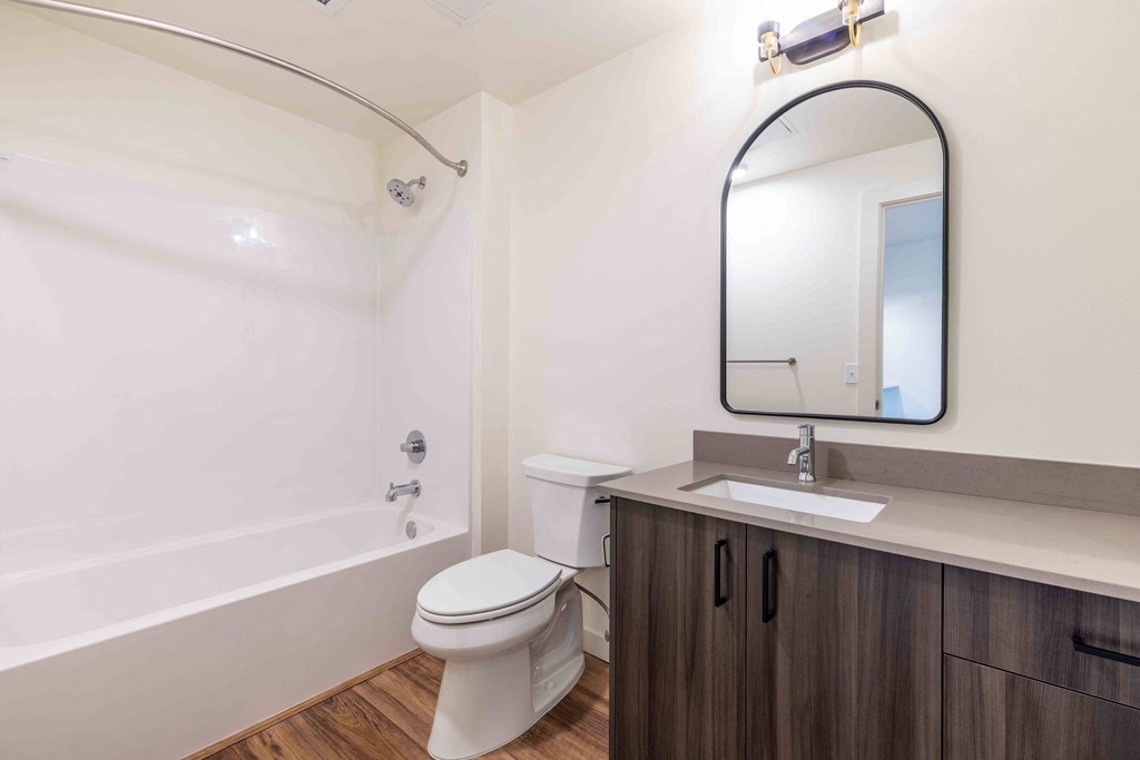 a bathroom with a toilet sink and a mirror at Rivulet, Washington