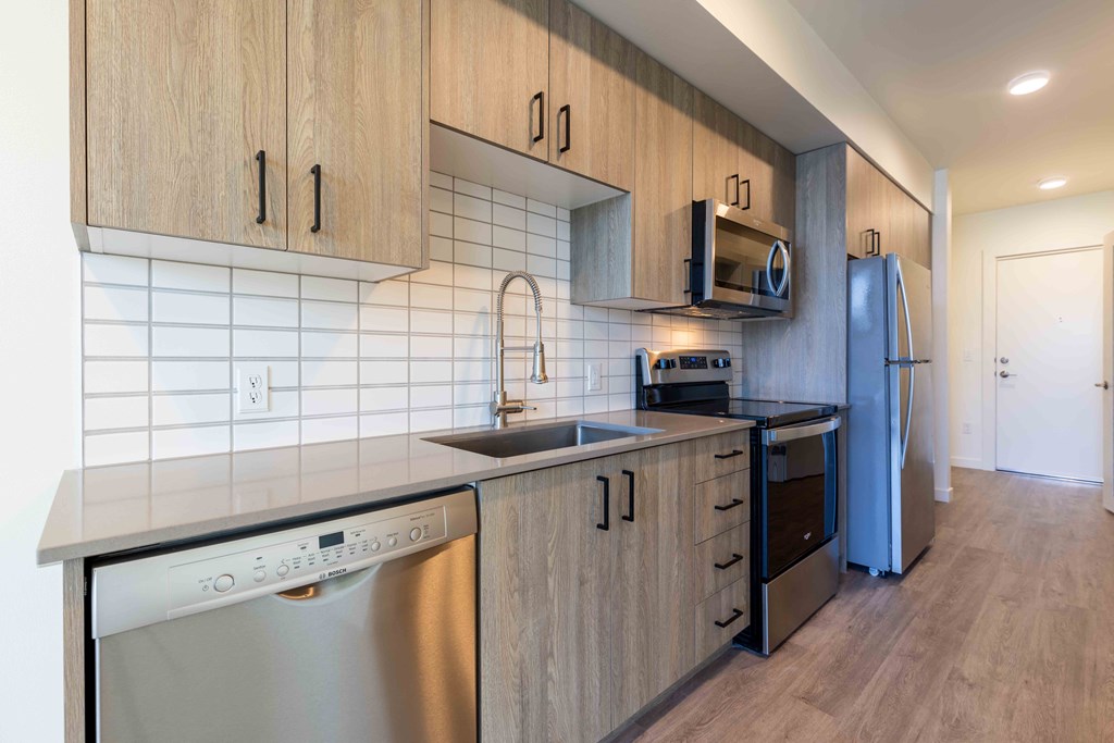 a kitchen with a sink and a stove and a refrigerator at Rivulet, Washington, 98383