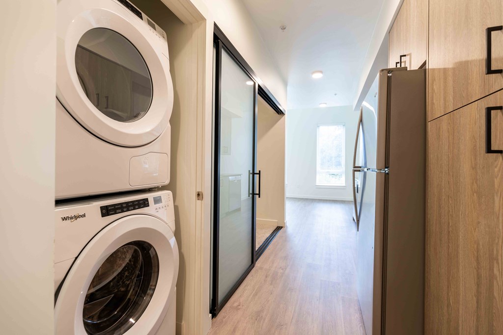 a washer and dryer in a laundry room with a door at Rivulet, Washington, 98383