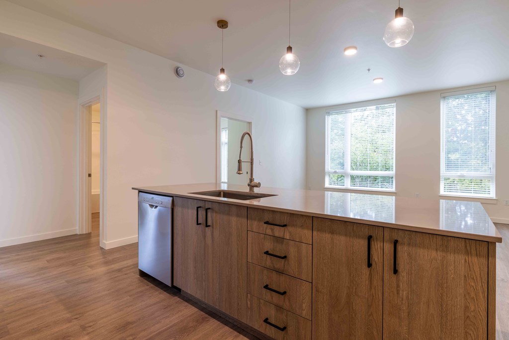 a kitchen with a large counter top and a sink at Rivulet, Silverdale, 98383