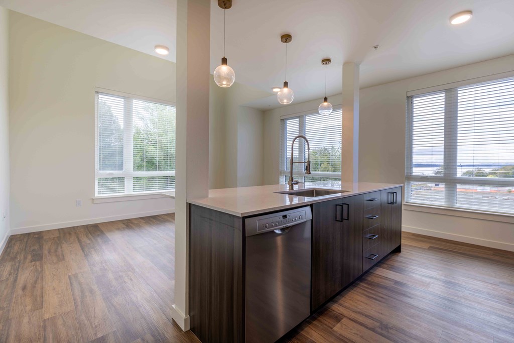 an empty kitchen with a large window and a sink at Rivulet, Silverdale