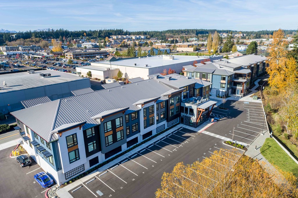 an aerial view of a building with a city in the background at Rivulet, Silverdale, 98383