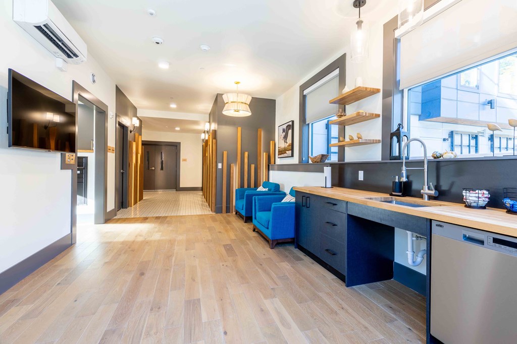 a long kitchen and living room with a large window and a long hallway at Rivulet, Silverdale Washington