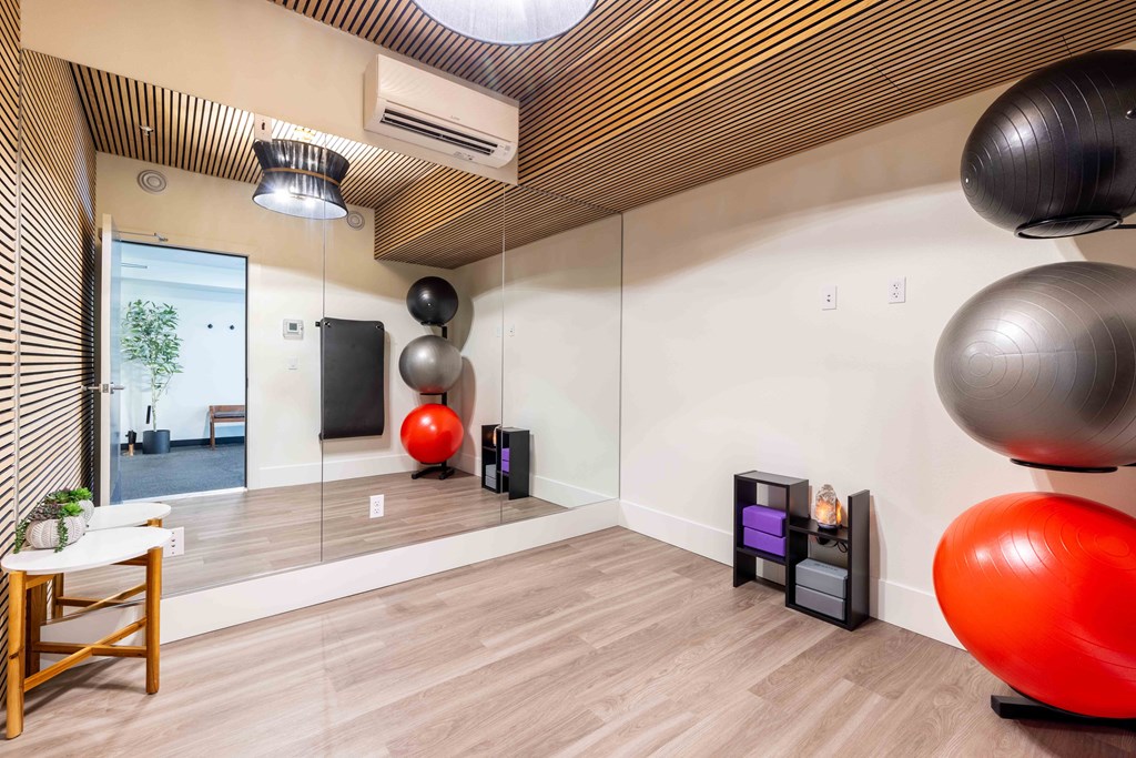 a workout room with exercise balls and a mirror in a building at Rivulet, Silverdale, 98383