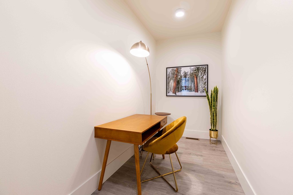 a home office with a wooden desk and yellow chairs at Rivulet, Washington, 98383