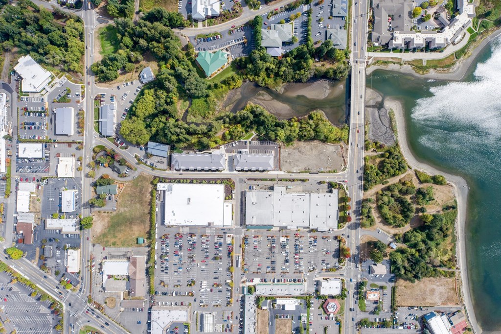 an overhead view of a city with a body of water and buildings at Rivulet, Washington