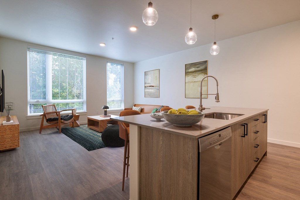 an open living room with a kitchen and dining area at Rivulet, Silverdale, WA
