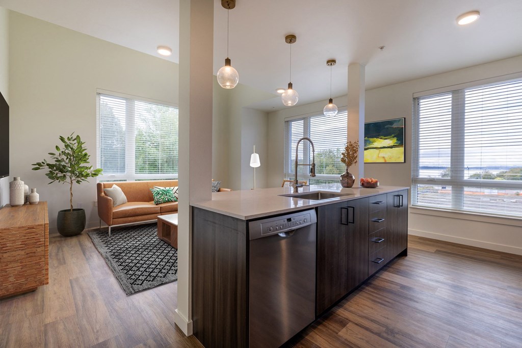a kitchen with a large island and a living room at Rivulet, Washington, 98383