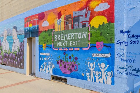 A mural on a wall with the words at Spyglass Hill Apartments, Bremerton, 98337