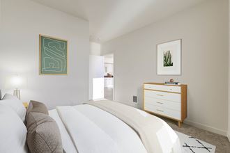 a bedroom with a bed and a dresser - Photo Gallery 2