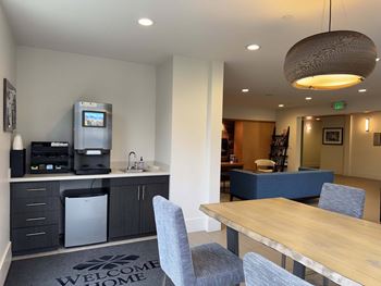 A kitchen area with a coffee machine and a fridge  at Spyglass Hill Apartments, Bremerton, 98337