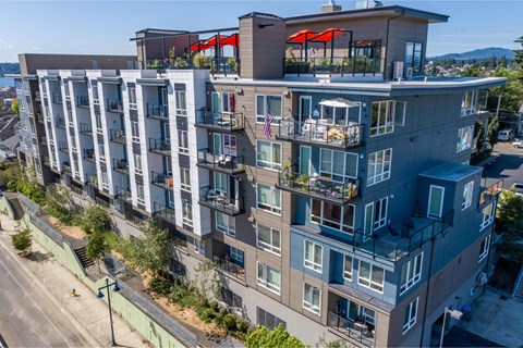 an aerial view of a large apartment building with balconies and decks at Spyglass Hill Apartments, Bremerton, 98337
