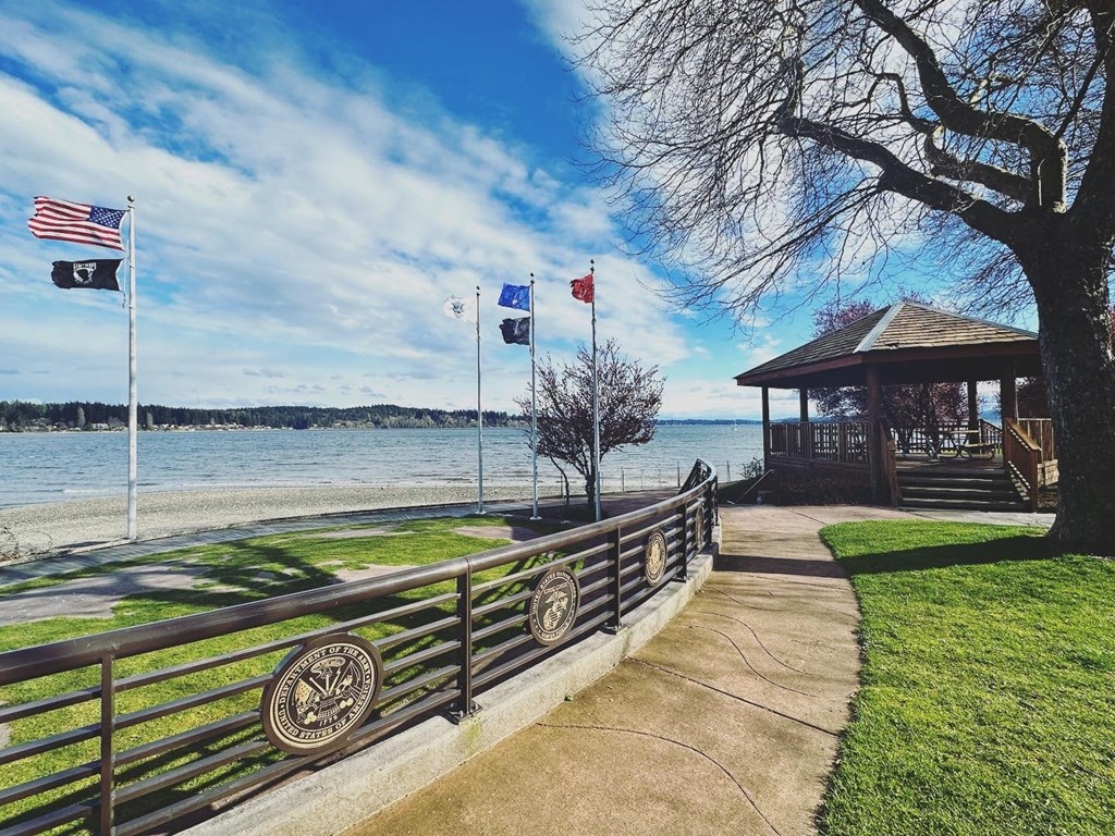 a path leading to a gazebo with a view of the water at Rivulet, Washington