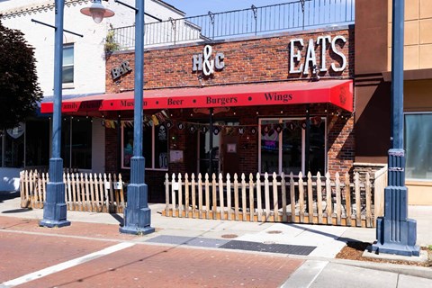 A restaurant named H & Eats is located on a street corner  at Spyglass Hill Apartments, Bremerton, 98337