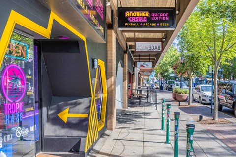 A yellow arrow on a black background points to the right  at Spyglass Hill Apartments, Bremerton, 98337