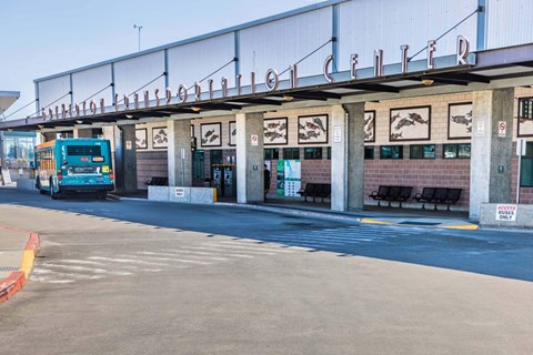 A bus is parked at a bus stop with a sign that says  at Spyglass Hill Apartments, Bremerton, 98337