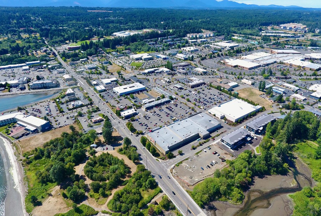 an aerial view of a city with a river in the background at Rivulet, Silverdale, 98383