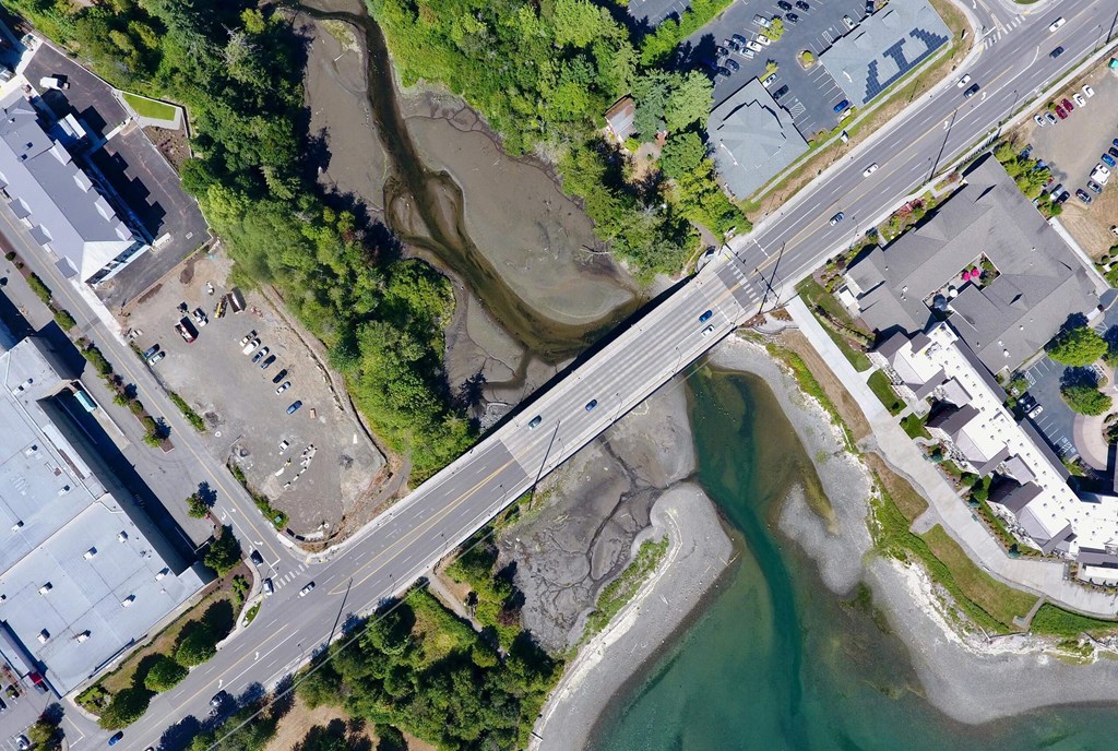 an aerial view of a bridge over a body of water at Rivulet, Silverdale Washington