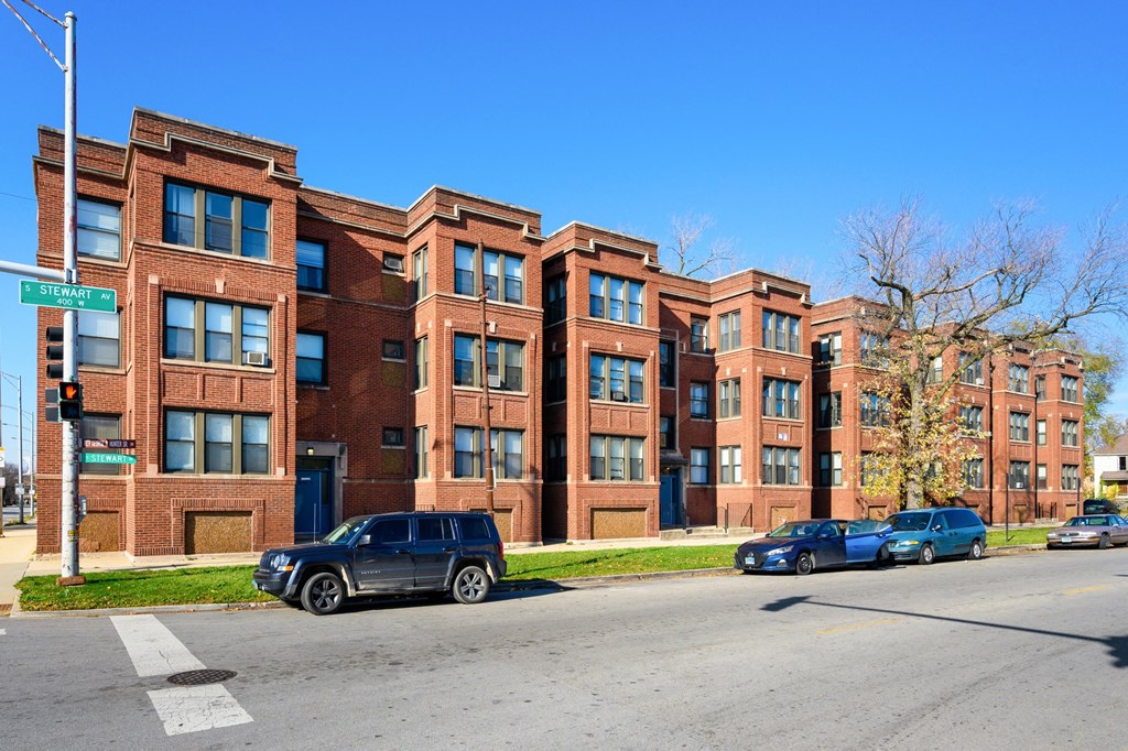 a row of brick apartment buildings on a city street