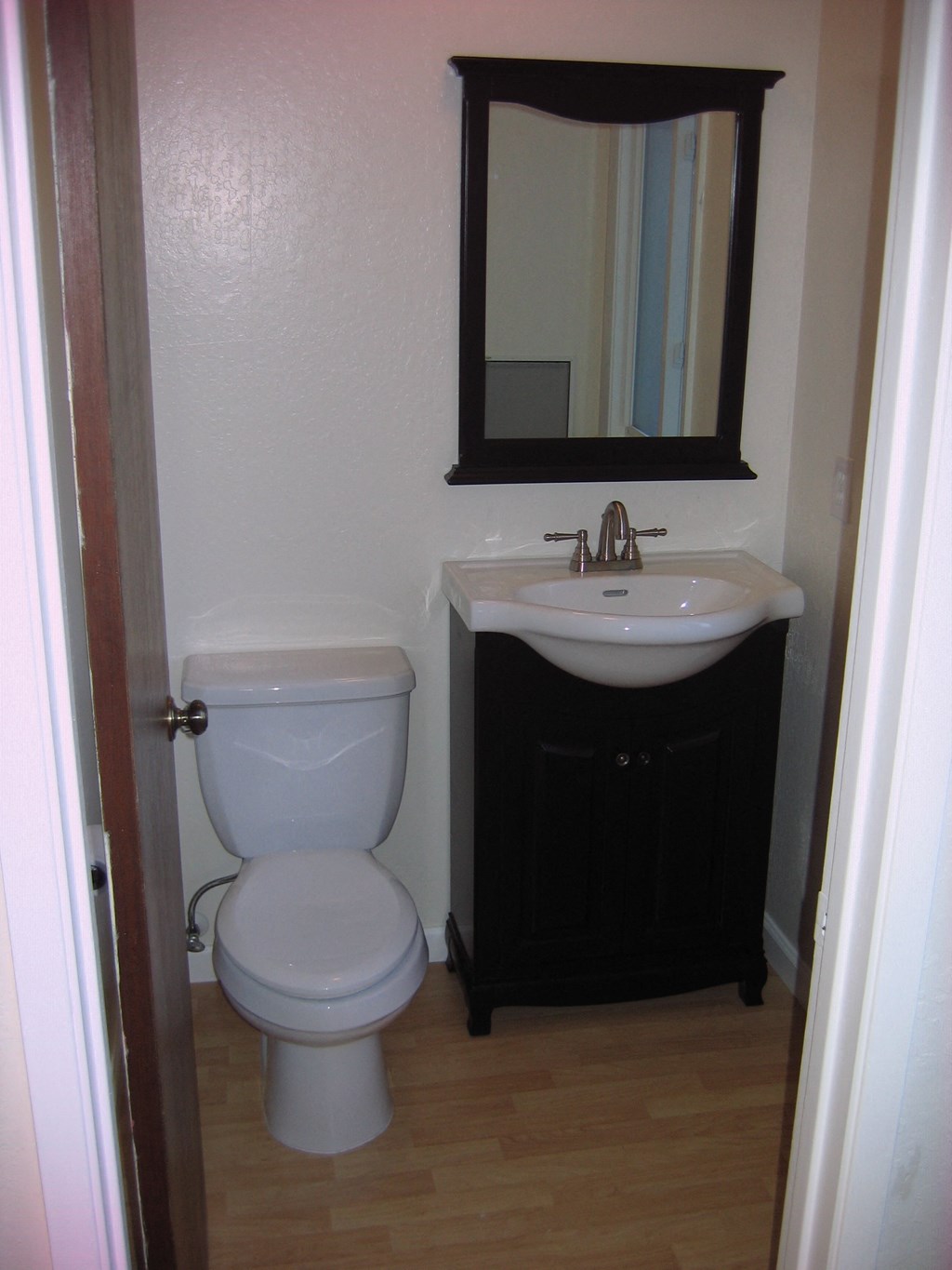 a small bathroom with a toilet and a sink