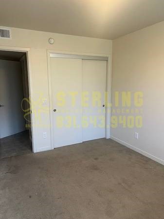 A room with a door and a Sterling logo on the wall.