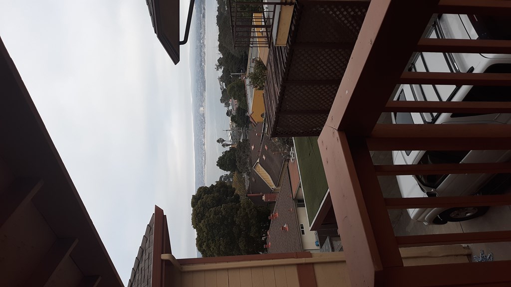A view from below looking up at a tall building.