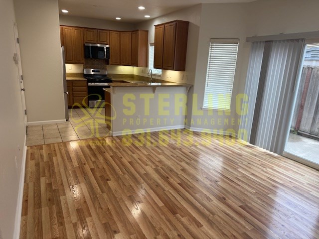 A kitchen with wooden floors and a countertop.