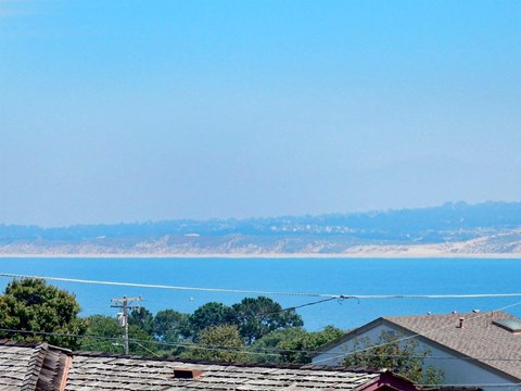 the view of the lake from the roof of a house