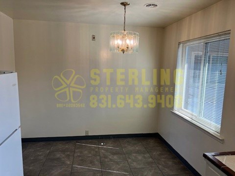 A Sterling Property Management office with a phone number on the wall.