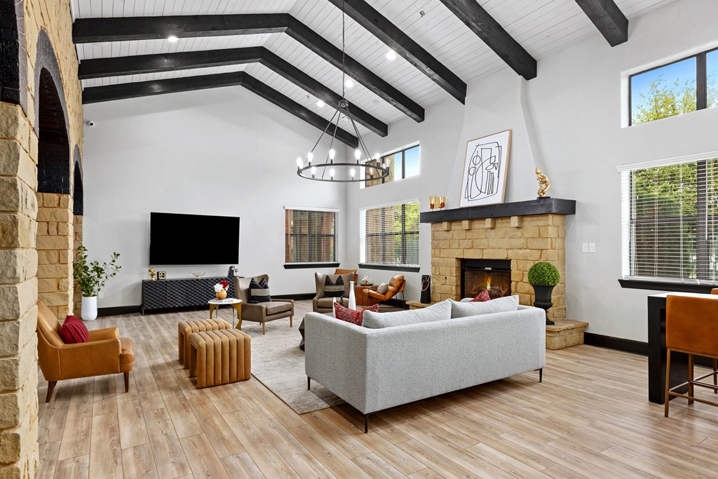 lounge area with couches and a fireplace at Bella Madera Apartments, Texas