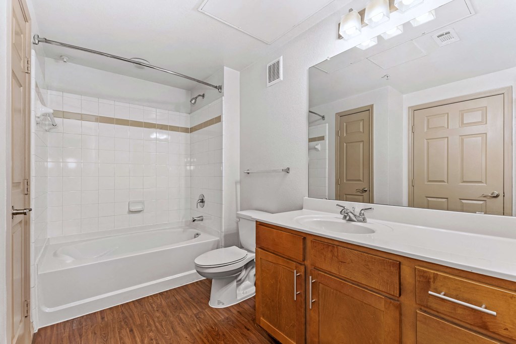 a bathroom with a sink toilet and a bath tub
