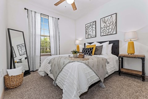 a bedroom with a large bed and a window