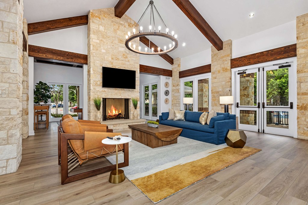 clubhouse lounge area with couches and a fireplace