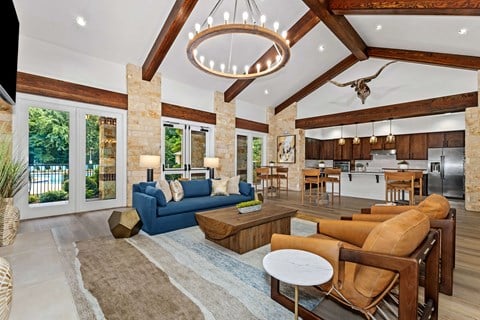 a living room with a blue couch and a table