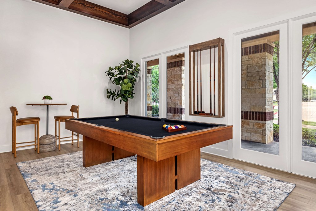 a billiards table in a living room with a pool table