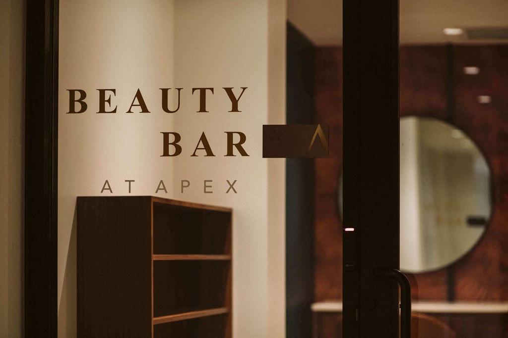 glass door with decal reading Beauty bar at apex looking into a conference room at The Apex at CityPlace, Overland Park, Kansas