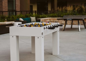 a foosball table on an outdoor patio - Photo Gallery 4