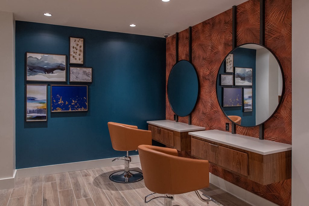 two chairs at desks and two circular mirrors on the wall at The Apex at CityPlace, Overland Park