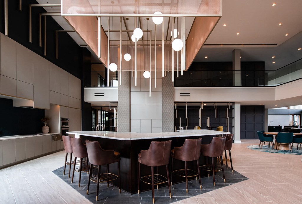 large indoor bar with 7 barstools seated around the countertop at The Apex at CityPlace, Overland Park, Kansas