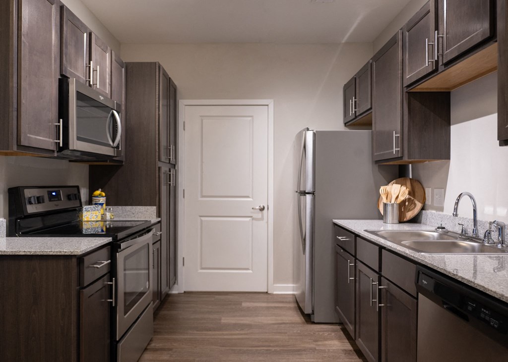 A fully-equipped kitchen at Aspen Ridge 55+ Apartment Community in Olathe, KS.