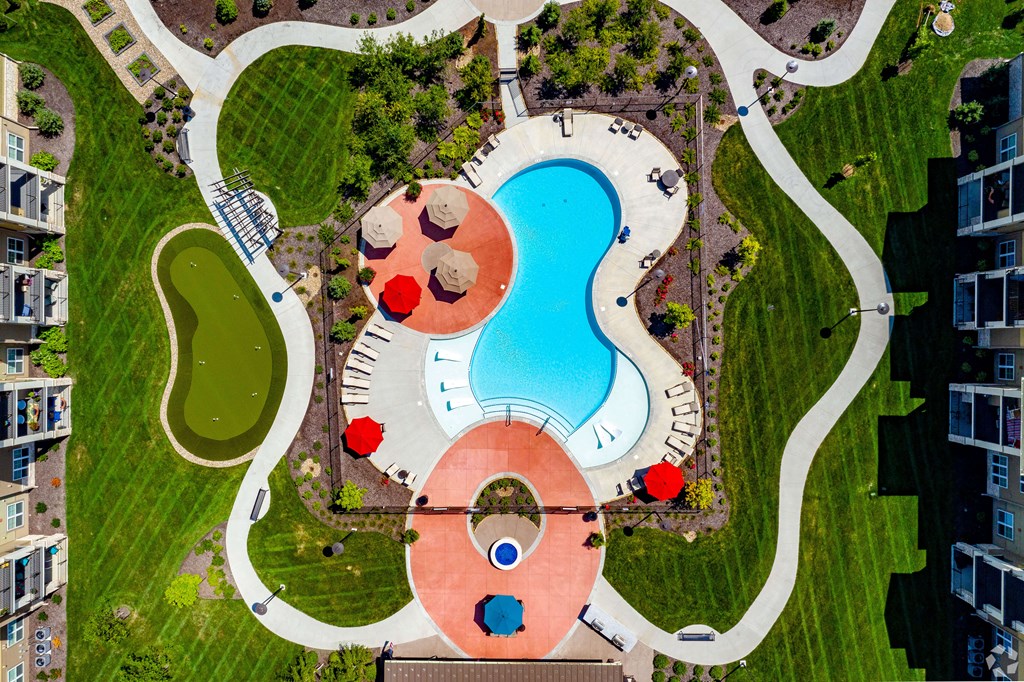 Putting Green, Swimming Pool, Grilling Stations, and Walking Trails at Aspen Ridge 55+ Apartment Community in Olathe, KS