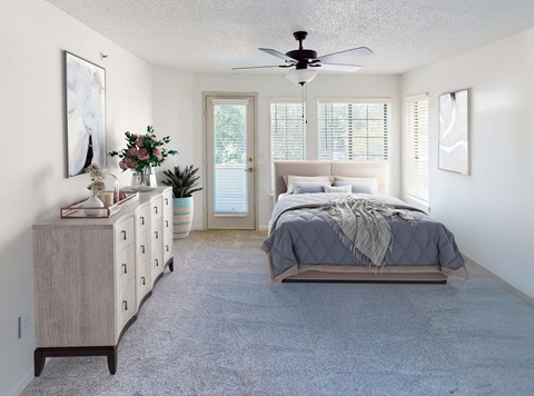 A bedroom with a bed, dresser, and a ceiling fan.