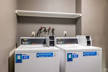 Two AT&T branded machines are on a shelf.