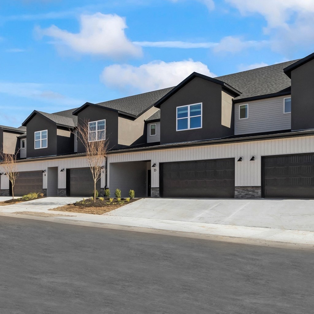 townhome with a street in front of it at Hillcrest Village, Springdale, 72762