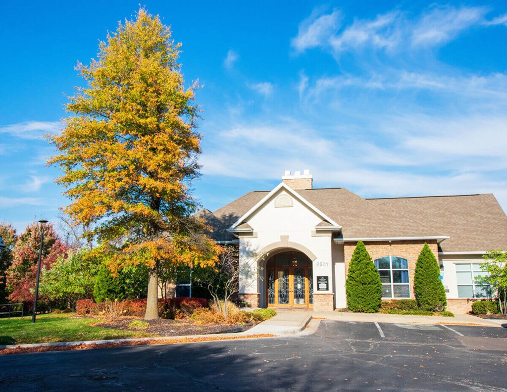 A building with a parking lot in front of it.