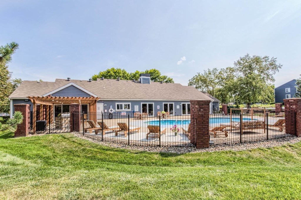 A house with a pool and a covered patio.