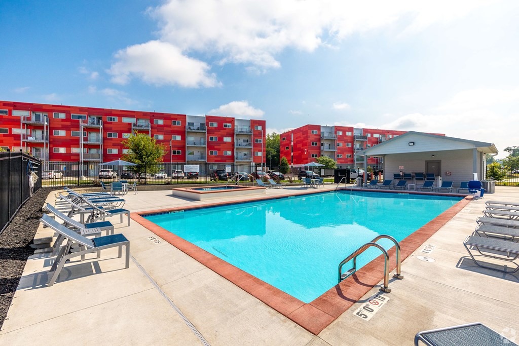 a swimming pool with a building in the background