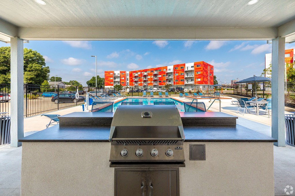 the preserve at ballantyne commons clubhouse with a gas grill and pool